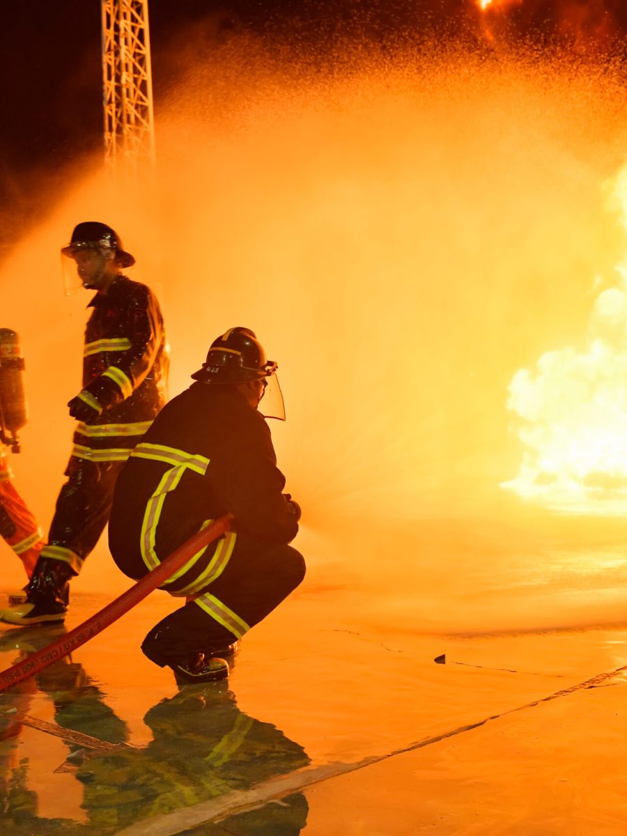 Blurs and silhouettes of firefighters extinguishing fires and helping victims.